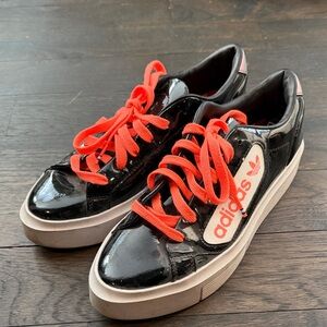 Adidas Glossy Black Sneakers with Bright neon orange Accents